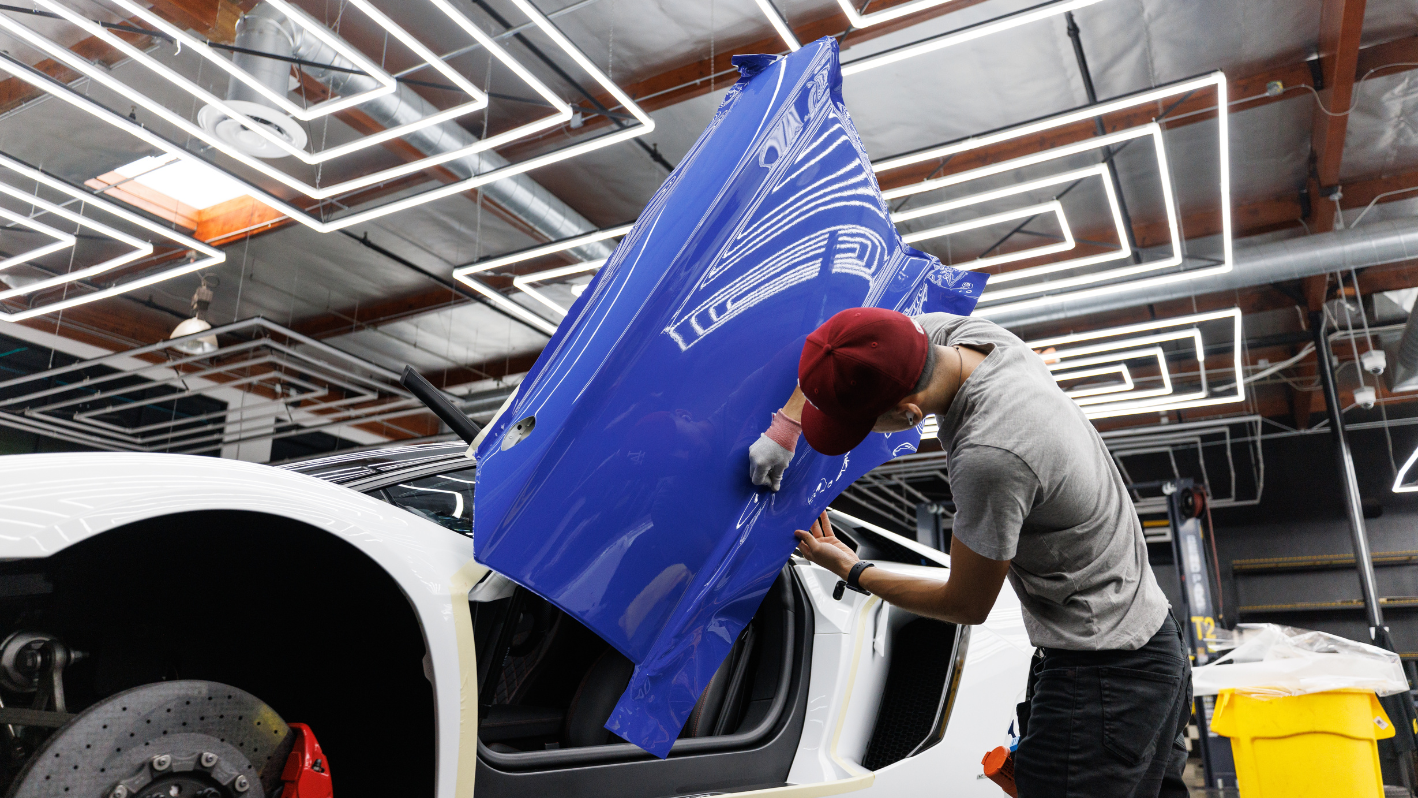 A man working on a car in a garage